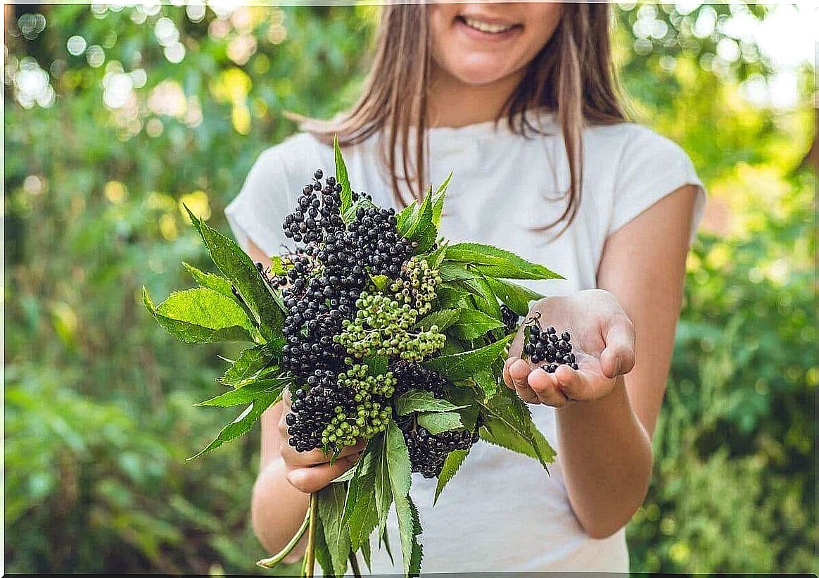 Girl with bunch of berries