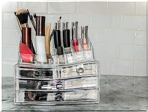 A storage full of make-up and brushes