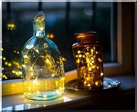 Glass bottle lamps by a window