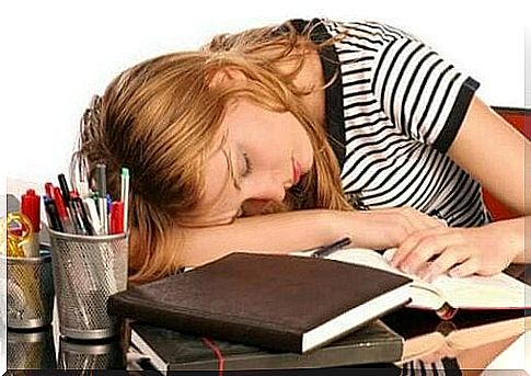 Woman sleeps on her desk