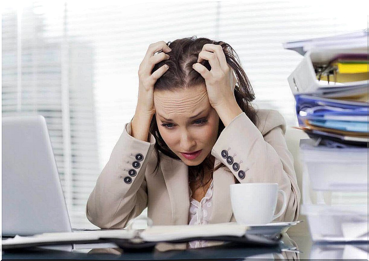 Woman stressed at her desk