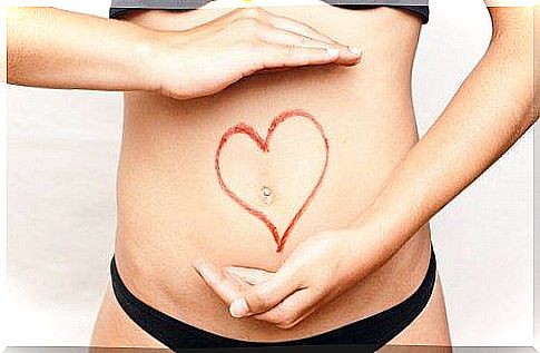 Heart and hands on a belly