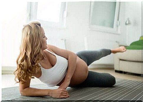 A pregnant woman doing yoga