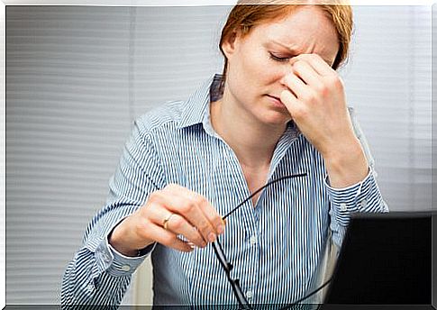 Working woman suffering from headache