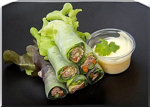 Three delicious wraps with lettuce, vegetables and fruit