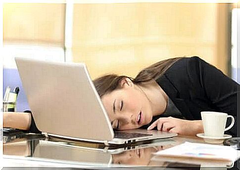 Woman sleeps while working